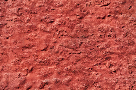 老红色被风化的粗糙的墙壁纹理