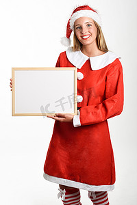 穿着圣诞老人衣服、带白板的微笑金发女郎