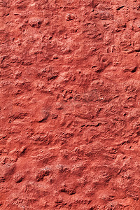 老红色被风化的粗糙的墙壁纹理