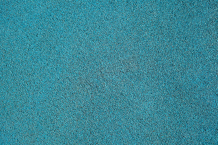 二次元窗外的操场摄影照片_用于田径跑道和儿童游乐场的蓝色碎橡胶的背景纹理