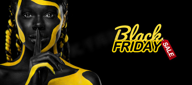 星期五黄色摄影照片_黑色星期五销售和购物概念 有人体油漆的女人。