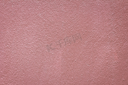 摇滚墙摄影照片_垃圾摇滚淡红色墙背景。