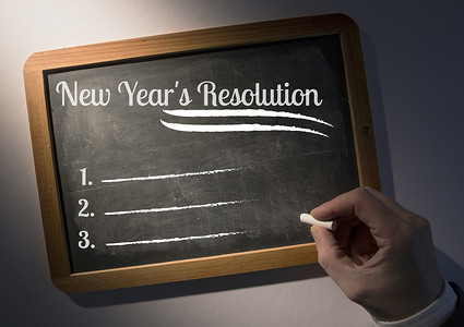 新年手绘图摄影照片_在石板上手写新年决议目标