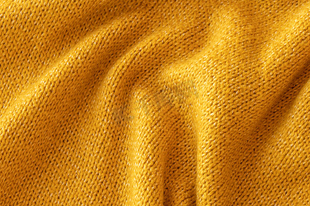 软针织黄色毛衣纹理特写。