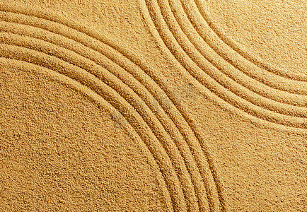 黄沙背景夏季海滩温暖上的两条弧线