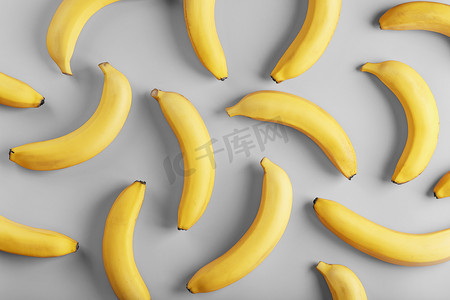 2021年灰色背景时尚色彩上黄色香蕉的明亮图案