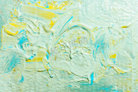 蓝邀请函摄影照片_丙烯酸漆的彩色背景滴下蓝黄色纹理、复制空间、横幅背景