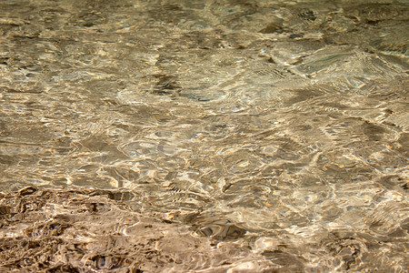 棕色闪光摄影照片_海面沙质。
