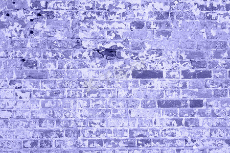 破裂和纹理的紫色墙壁，砖墙背景。 