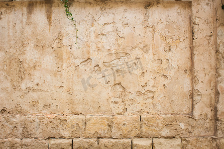样机墙摄影照片_老风化的石头和石膏方形矩形墙背景