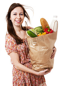 杂货图片摄影照片_年轻女子拿着一大袋健康杂货 - 图库图片