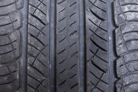 浴室防滑垫摄影照片_关闭宏观旧轮胎背景，由旧轮胎制成的防滑橡胶垫。