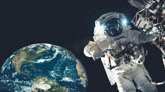 航天员太空摄影照片_宇航员太空人在执行航天任务时进行太空行走