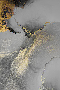 液体流体摄影照片_纸上大理石液体水墨艺术画的深金色抽象背景。