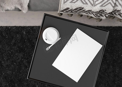 本子样机摄影照片_白色的书封面模拟在黑色的桌子上。
