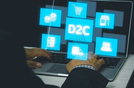 手在计算机笔记本电脑图标符号上打字直接向消费​​者 D2C 虚拟屏幕互联网业务大数据技术概念。