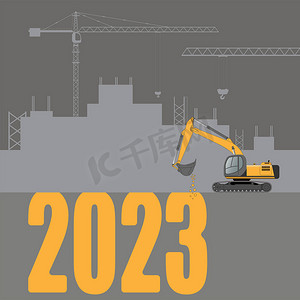 追梦2023摄影照片_挖掘机正在挖掘新年数字。