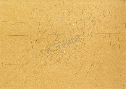 高度细致的棕色纸板纹理，有许多刀切痕迹和磨损的划痕，使用具有撕裂表面的垃圾细粒分层纸板，用于壁纸设计