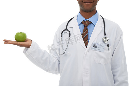远离非法集资摄影照片_这是为了让医生远离……拿着苹果的医生。