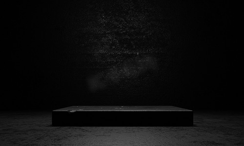 黑色舞台墙摄影照片_黑色水泥和混凝土舞台讲台，有聚光灯和深色垃圾墙背景。