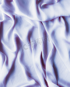 丝绸邀请函摄影照片_紫色柔软的丝绸质地，平底背景