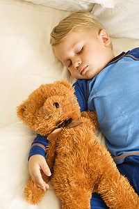 暴力迪吧摄影照片_宝宝和熊一起睡觉。