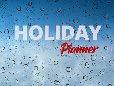 书法年字摄影照片_节日快乐，假日策划者发短信，带雨滴、水滴和蓝天背景