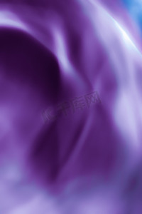 波浪线摄影照片_紫色抽象艺术背景、丝绸质感和运动波浪线，适合经典奢华设计