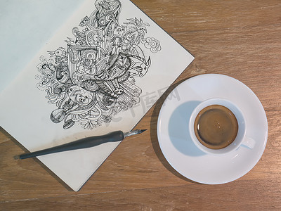 线条美学摄影照片_用黑色墨水在纸上用一杯咖啡绘制涂鸦线条艺术