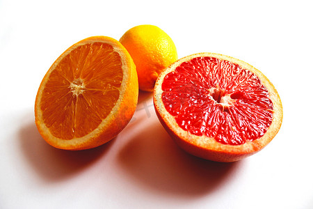 橙广告摄影照片_橙柚子和柠檬分成两半