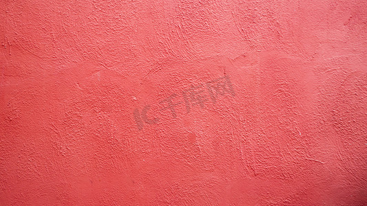 粉红色灰泥质朴的墙壁纹理背景。