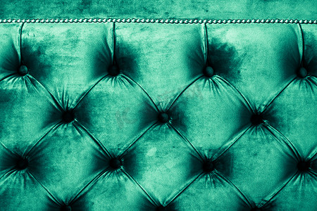 翡翠豪华天鹅绒绗缝沙发内饰，配有按钮、优雅的绿色家居装饰质感和背景