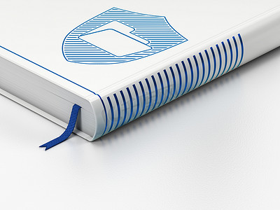 电脑文件夹图标摄影照片_财务概念： 闭合的书，白色背景上带盾牌的文件夹