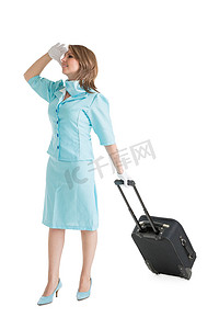 蓝色制服的空姐带着她的包
