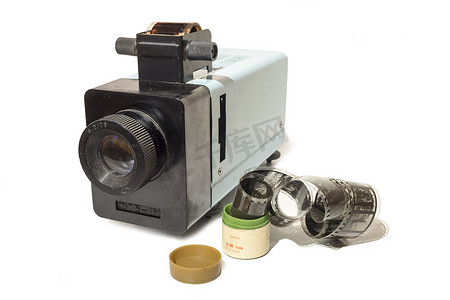 电影胶片摄影照片_带胶片的旧幻灯片放映机。