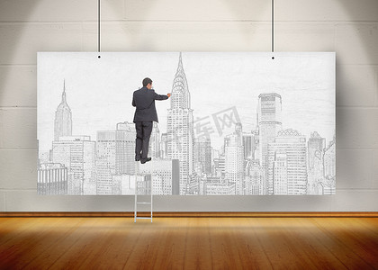 商人站在梯子上，在挂着的海报上画一座城市
