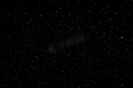 银河系摄影照片_夜空背景中的星星纹理银河系的星星辉光。