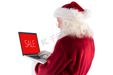 圣诞老人的复合图像使用笔记本电脑
