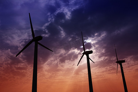 电商简约大气摄影照片_戏剧性的日落天空上的风力发电机风车