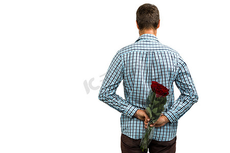 玫瑰图案摄影照片_男人藏玫瑰的后视图