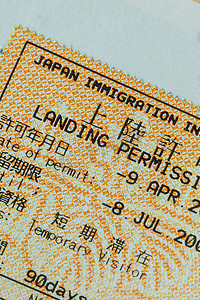 旅行印章摄影照片_日本护照印章签证旅行概念背景