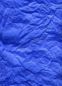 蓝色褶皱纸摄影照片_蓝色丝绸纸
