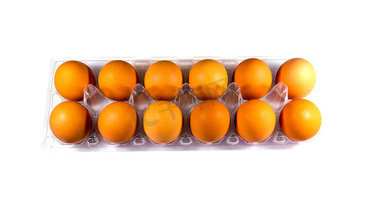 塑料托盘上有十几个鸡蛋。