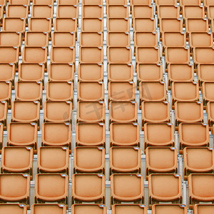 足球观众摄影照片_体育场的橙色座位