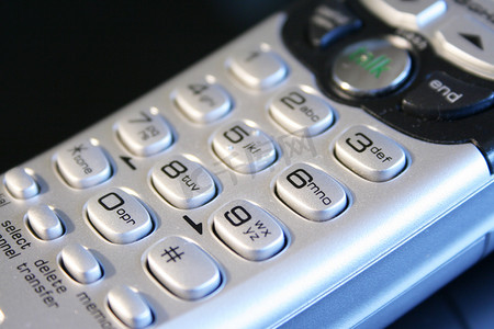 灰色电话数字摄影照片_银色无绳电话键盘的特写。