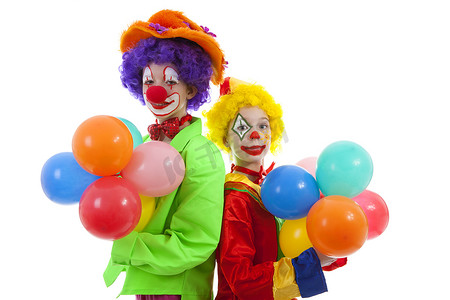 孩子们拿着气球打扮成色彩缤纷的滑稽小丑