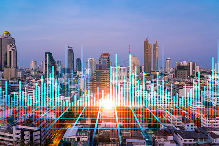 基金管理摄影照片_在日落时分,在曼谷的空中全景全息图上闪耀着FOREX图形全息图.亚洲的股票和债券交易。基金管理的概念。加倍暴露.