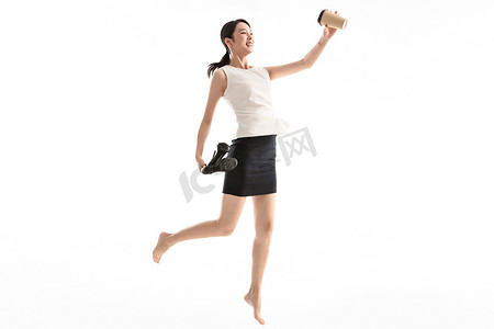 个性女青年摄影照片_兴奋跳跃的商务女青年