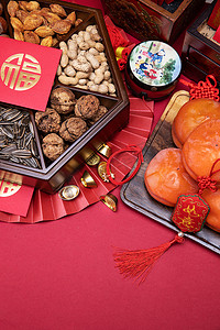 中式食物摄影照片_柿子和中式坚果果盘