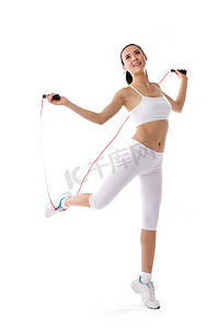 跳绳动作摄影照片_女人跳绳锻炼身体